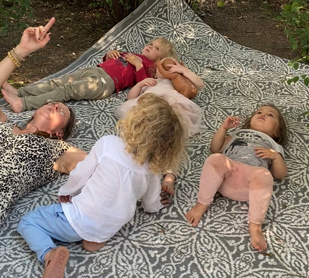 children lying on a blanket
