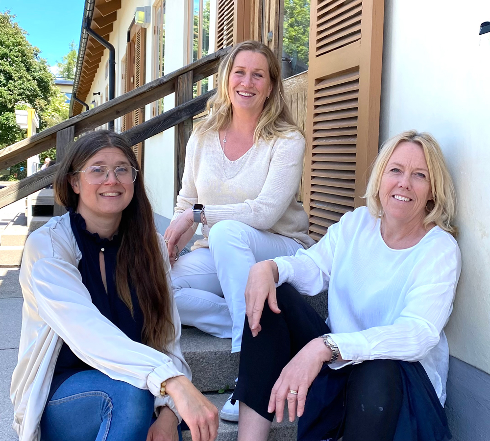 Three woman on a stair